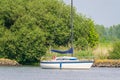 People on sailboat anchored on Spui river, Netherlands