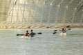 People sailing glass boats in a pool in The city of arts and sci