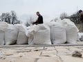 People in Saint Michael's Square preparing sandbags for defense during Russian invasion. Kyiv.