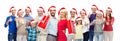 People in santa hats with sale sign at christmas Royalty Free Stock Photo