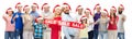People in santa hats with sale sign at christmas Royalty Free Stock Photo