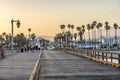 People at scenic old wooden pier in Santa Barbara in sunset Royalty Free Stock Photo