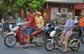 People on scooters are waiting green signal of Royalty Free Stock Photo