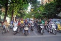 People on scooters are waiting green signal of Royalty Free Stock Photo