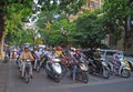 People on scooters are waiting green signal of Royalty Free Stock Photo