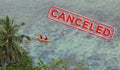 People in sea kayak on island coast tropical sea