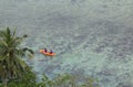 People in sea kayak on island coast tropical sea Royalty Free Stock Photo