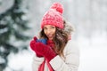 Happy young woman with tea cup in winter park Royalty Free Stock Photo