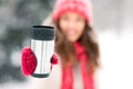 Hand holding tumbler or thermo cup in winter Royalty Free Stock Photo