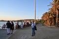 People seated next to the sea