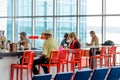 People seated at restaurant bar in an airport