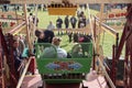 People in seats on ferris wheel fun fair carnival ride