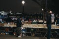 People at second hand book market in Southbank, London, in the evening Royalty Free Stock Photo