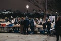 People at second hand book market in Southbank, London, in the evening Royalty Free Stock Photo