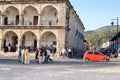 People are seen walking the cobble stone roads by the main Plaza of Antigua, Guatemala. Central America Royalty Free Stock Photo