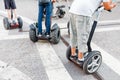 People on the segways in the city