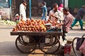 People sell apples at Chawri Bazar in Delhi, India