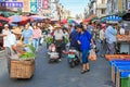 People selling and buying food in a traditional fruit and vegetable market of Taiwan Royalty Free Stock Photo