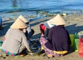 People selling fishes at the market in Phan Thiet, Vietnam