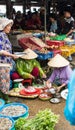 People selling goods at market in Hoi An, Vietnam