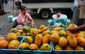 People selling papaya fruits at market in Yangon, Myanmar