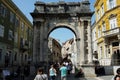 People at Sergius Arch or Golden Roman Gate of Pula, Croatia
