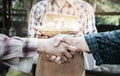 People shaking hands in a egg chicken farm,Handshake of business partners,farmer`s agreement. Agriculture agronomist