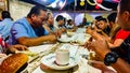 People sharing a meal at the Calenda San Pedro in San Pedro Apostal.