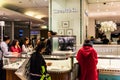 People shop in the Tiffany & Co. section in the Galeries Lafayette. Paris, France Royalty Free Stock Photo