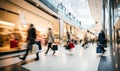 People with shopping bags moving in busy shopping mall. creating a dynamic motion blur Royalty Free Stock Photo