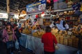 People shopping for cheese and groceries from Shops and markets in Downtown Cusco, Peru.