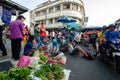 People shopping at the Chowrasta market. Beggar with hand at the floor.