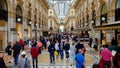 People shopping in famous Vittorio Emanuele Galleria, luxury boutiques and cafes