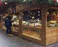 People shopping in French Christmas market in Bologna, Piazza Minghetti, Italy.