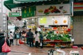 People shopping fruit and vegetable stall at Vegetable market in the morning at Hongkong