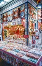 People shopping in Great Market Hall for souvenir. Hungarian Paprika, ceramic dish, handicraft embroidery, lace, egg.