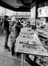 People shopping for international newspapers black and white Royalty Free Stock Photo