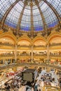 People shopping in luxury Lafayette department store of Paris, France Royalty Free Stock Photo