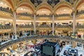 People shopping in luxury Lafayette department store of Paris, France Royalty Free Stock Photo