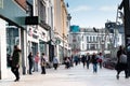 People shopping on Patrick Street in Cork, the city`s main street for stores, street performers, restaurants, and busy city life.