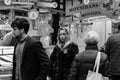 People shopping on Patrick Street in Cork, the main street for stores, street performers, restaurants; photographed in monochrome. Royalty Free Stock Photo