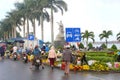 People shopping selling flowers outdoor street market, Hoi, Vietnam