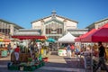 People shopping in summer on the market square in the old town of La Rochelle France