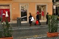 People on shopping tour in front of the dior store, rome, italy