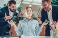 People shout at meditating worker in office. Royalty Free Stock Photo