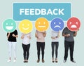 People showing customer feedback evaluation emoticons Royalty Free Stock Photo