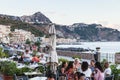 People in sidewalk restaurant in Giardini Naxos