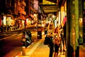 People on sidewalk in Tel Aviv shopping street at night Royalty Free Stock Photo