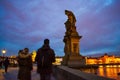 People sightseeing at picturesque Charles Bridge Prague at night Royalty Free Stock Photo