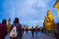 People sightseeing at picturesque Charles Bridge Prague at night Royalty Free Stock Photo